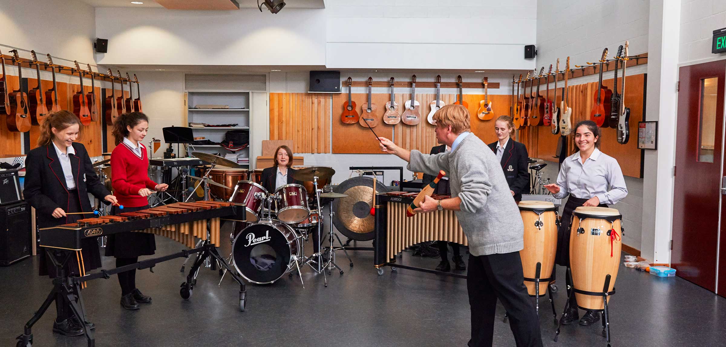 Teacher and six students in music studio