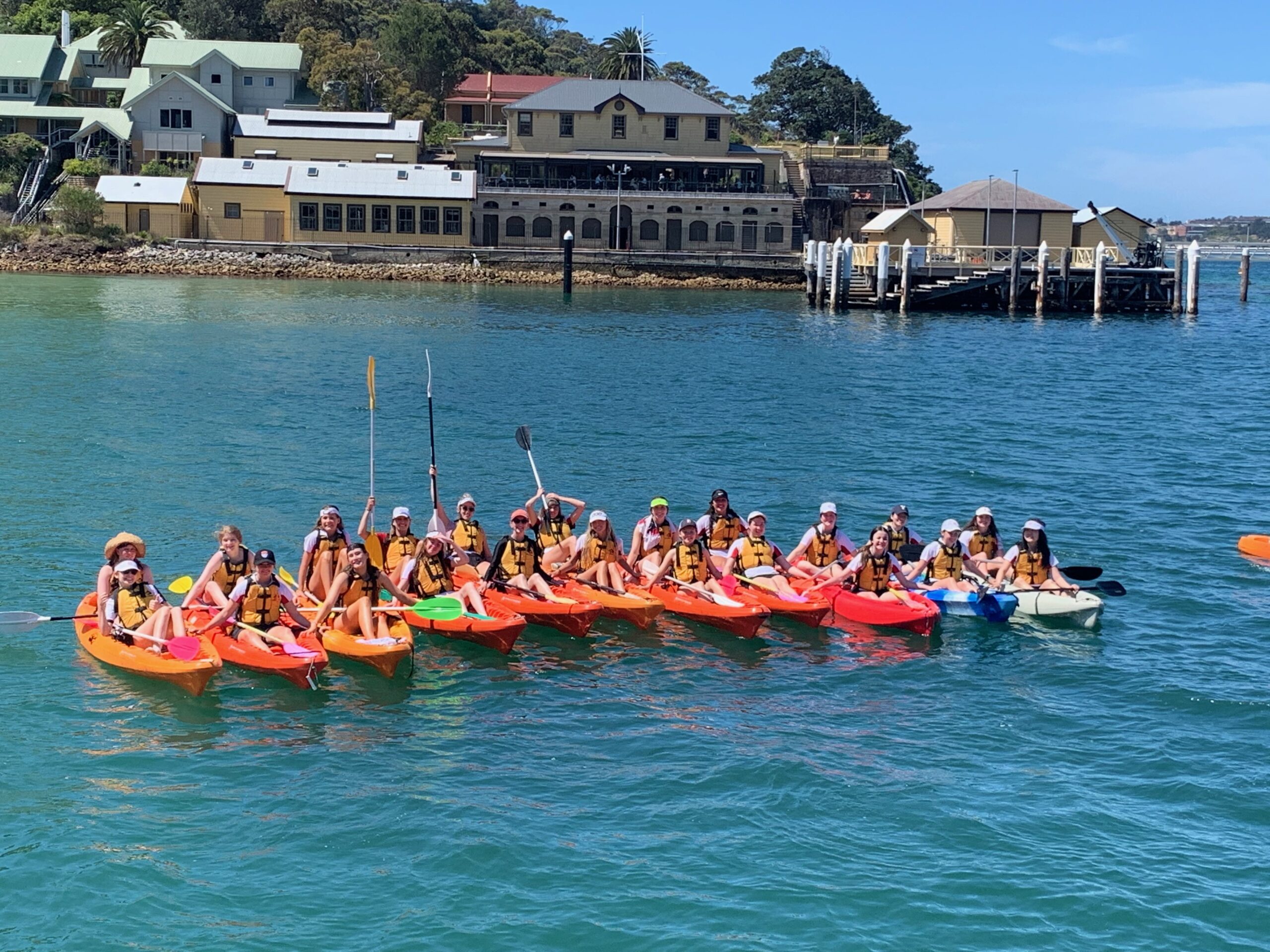 Group kayaking on a sunny day.